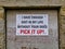 A sign in a doorway on a building in Middlesmoor, Nidderdale, Yorkshire, UK asking dog owners to pick up their dog`s excrement