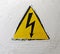 The sign of the electric voltage. Hazard warning