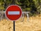 Sign entry is prohibited against the background of forest and dry grass