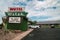Sign and exterior of the Motel Welsh, a small, locally owned motorcourt style retro motel,