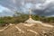 A sign of faith, a cross, beautiful clouds in a dry land at Cariri Paraiba Brazil Countryside