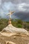 A sign of faith, a cross, beautiful clouds in a dry road at Cariri Paraiba Brazil Countryside