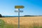 sign and farmland, mountain backdrop and beautiful sky