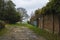 Sign of the Hillingdon Trail near the walls of the Stable Block in Cranford Park