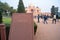 Sign for Humayans Tomb ancient complex and ruins with defocused tourists exploring in the