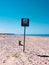 A sign indicating the boundaries of the beach for nudists