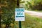 Sign indicating parking area in a rural woodland area