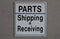 Sign indicating parts department and shipping & receiving