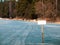 a sign on the lake`s ice forbidding drilling ice. blank for your text.