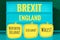 Sign with light inscription in German Brexit, England, Northern Ireland, Wales and Scotland in English Northern Ireland, Scotland,