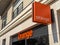 Sign and logo of an Orange store, formerly known as France Telecom