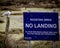 A sign on a nature reserve stating no landing roosting birds