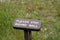 Sign in Olympic National Park reminding hikers to stay behind the wall at Hurricane Ridge