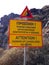 A sign on the path to Red Beach with an identical inscription in Greek and English:`Attention! Danger of landslides. No entry.`