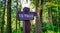 Sign pointing To Falls on a hiking trail in the rain forest.