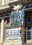 Sign promoting an Antique Market in front of the Doge`s Palace, a historical building in Genoa, northern Italy