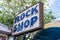 Sign for the Rainbow Rock Shop, an attraction along historic Route 66 featuring geodes, gems and