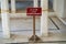 Sign reading Close closed for Maintenance at a tourist attraction in Udaipur, India. White columns in the background