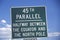 A sign that reads ï¿½45th Parallelï¿½