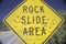 A sign that reads ï¿½Rock Slide Areaï¿½