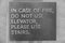 A sign that says, In Case Of Fire, Do Not Use Elevator, Please Use Stairs, which direct people of what to do in case of an fire