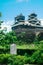 Sign says that Here is Kumamoto Castle Good View Point at the Kumamoto Castle is located in Kumamoto Prefecture, Japan. At this ti