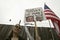 A sign shows President Bush and VP Cheney as the devil with the US Flag at an anti-Iraq War protest march in Santa Barbara