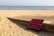 a sign at the side of a slipway on a beach with a sign saying keep clear emergency lifeboat launch area