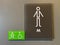 A sign signifying a mens bathroom or lavatory entrance