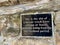 Sign at the Site of a former medieval cruck truss cottage, 35 St Johns St, Wirksworth.Wirksworth, Matlock, UK. May 20, 2023.