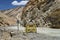 Sign SMILE PLEASE nearby mountain road in Ladakh