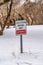 Sign on snowy terrain in winter that reads Equestrian Parking Only Entrance