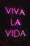 Sign in Spanish with neon light with the text Viva la Vida.