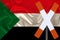 Sign, stop, attention on the background of the silk national flag of Sudan, the concept of border and customs control, violation