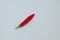 Sign or symbol division, made from the fruit of fresh chilli red pepper with a green stalk