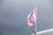 Sign and Symbol. Thai National Tricolor Flag 5 horizontal stripes in colors red, white and blue at center on boat on cloudy sky