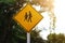 Sign for telling  People walking across the road traffic sign  Yellow iron nameplate  Rural road background