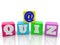At sign on toy cubes with quiz concept