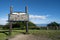 Sign welcomes visitors to Homer Alaska on a sunny summer day