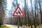 Sign about of wild moose on a forest road