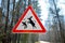 Sign about of wild moose on a forest road