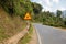 Sign winding road on a mountain road