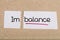 Sign with word imbalance turned into balance