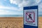 Sign written in French indicating an unpatrolled beach, Anglet, France