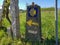 Sign with yellow scallop shell signing the way to Santiago de Compostela on the Saint James pilgrimage way, Camino Portuguese