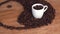 A sign of yin and yang from coffee beans. The yin and yang sign is laid out on the kitchen marble table