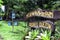 Signage at the entrance of a private bee farm where rows of honey bee hive boxes were built