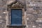 Signage of Museu D`Historia De Barcelona on Ancient Stone Window Frame