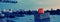 Signal orange lamp boats on a blurry city background. Web banner