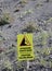 Signal on the slope of Volcano with text in English and Italian